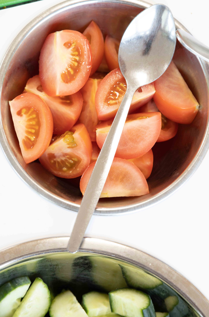 close up shot of tomatoes and cucumber